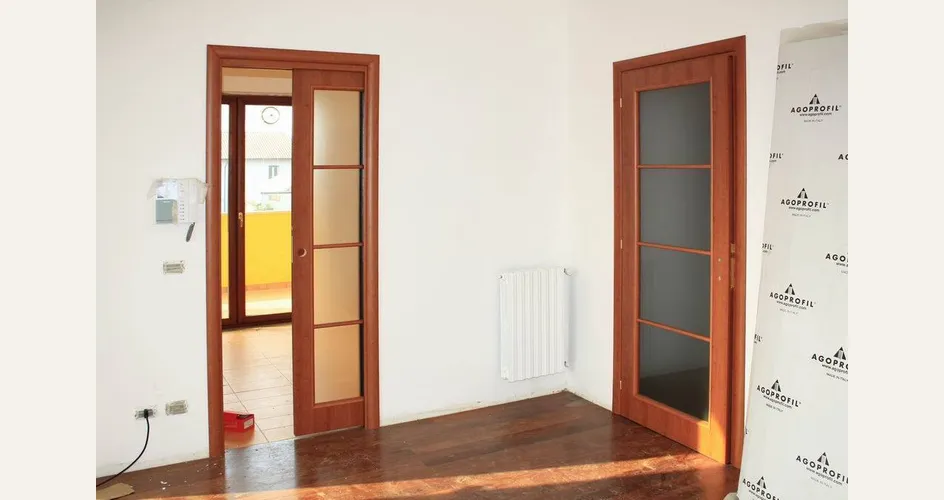 Porte a scomparsa in legno e vetro